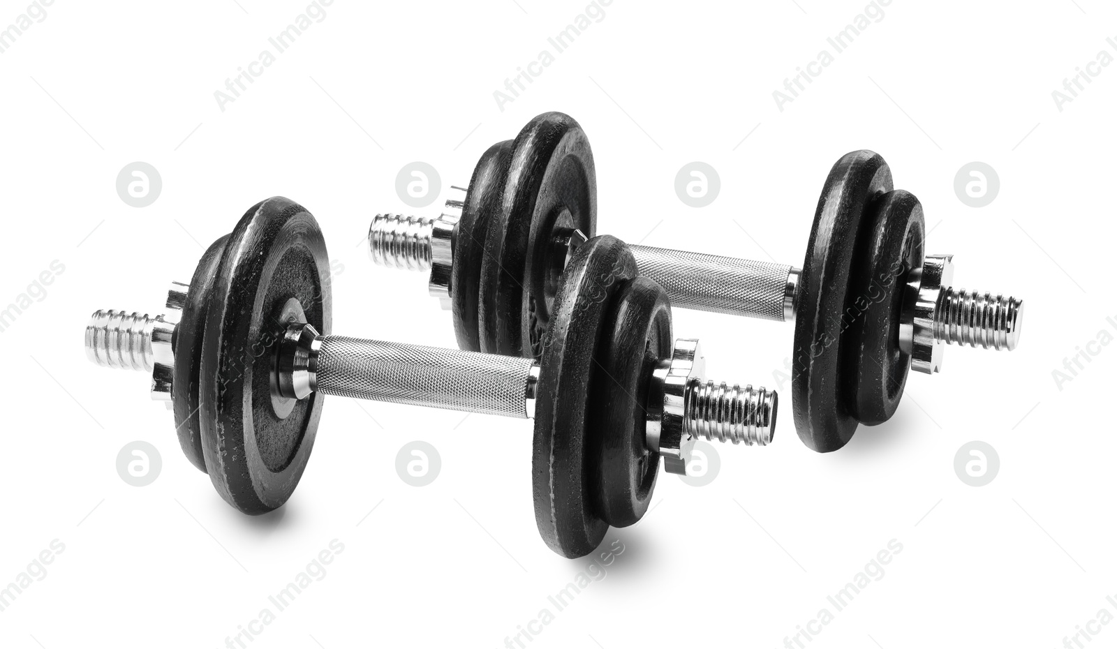 Photo of Metal dumbbells isolated on white. Sports equipment