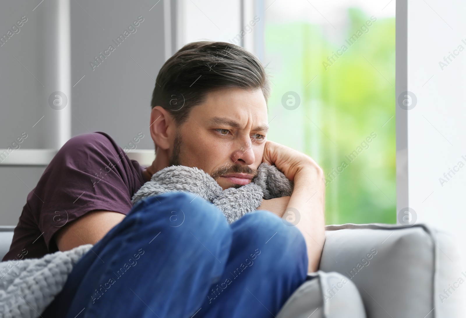 Photo of Lonely man suffering from depression at home