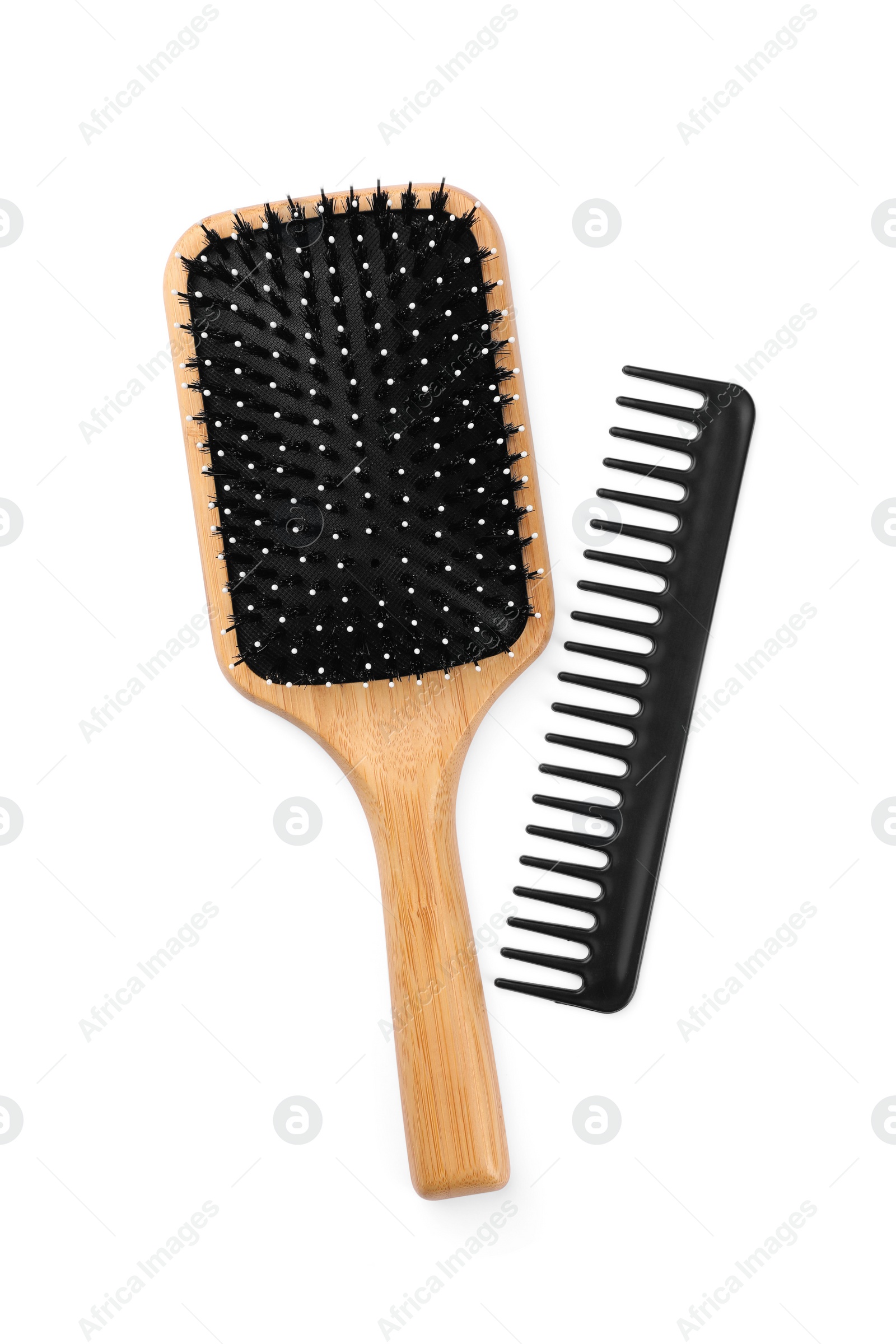 Photo of New wooden hair brush and comb isolated on white, top view