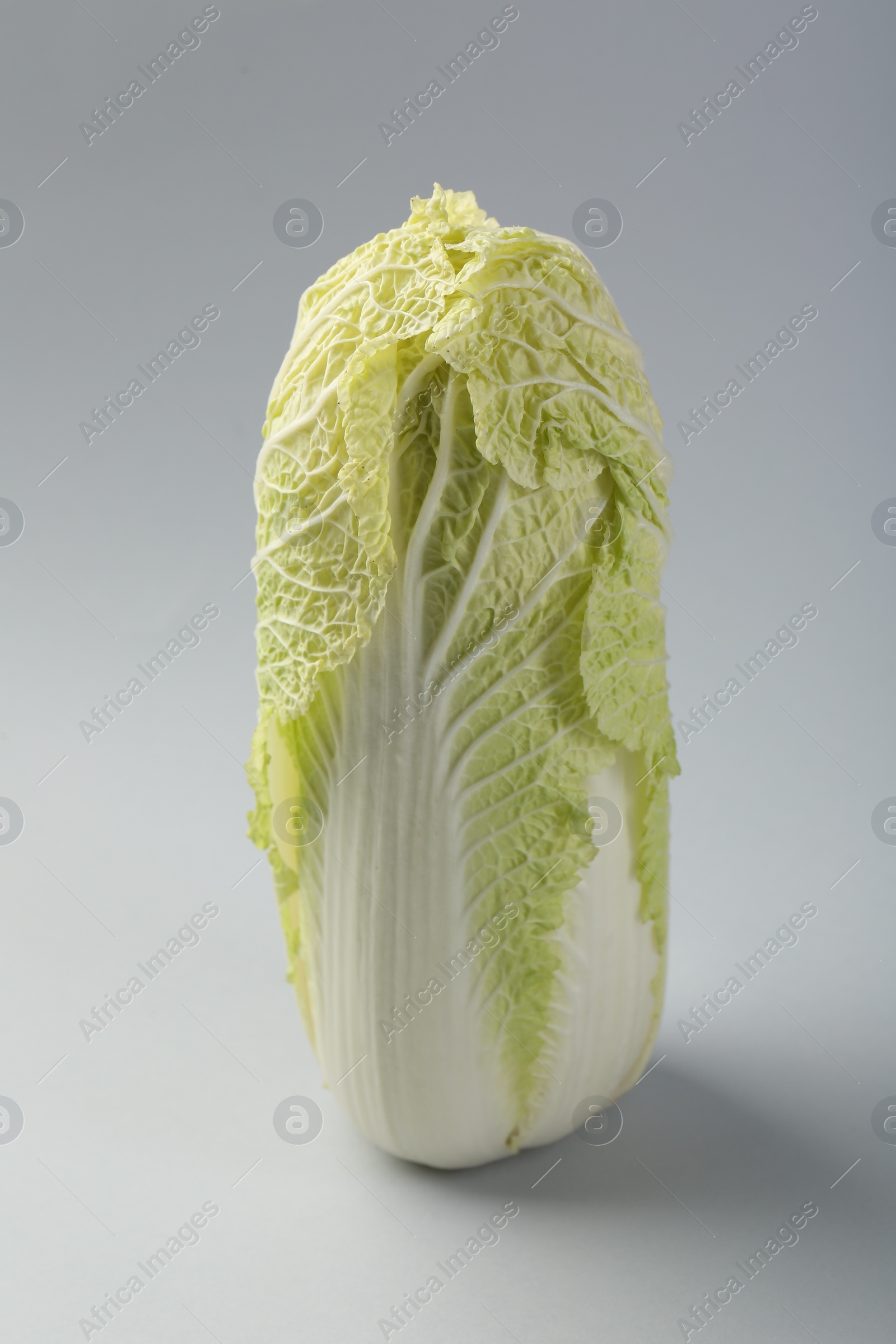 Photo of Fresh ripe Chinese cabbage on light grey background