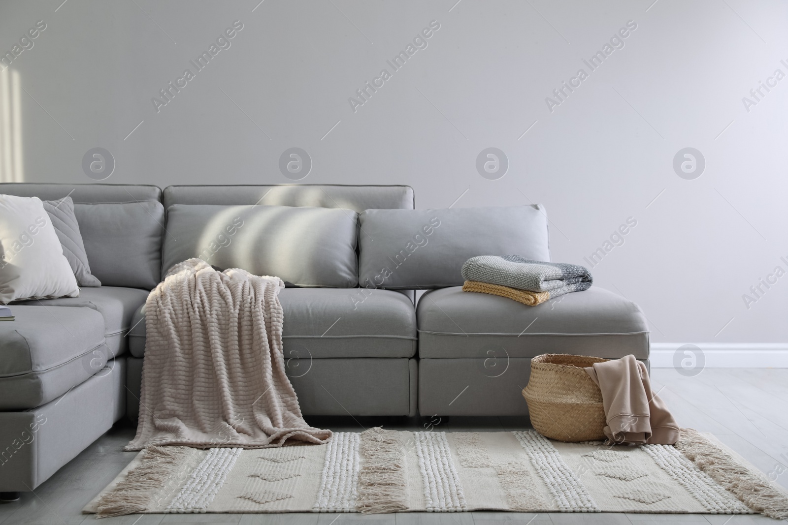 Photo of Living room interior with large grey sofa