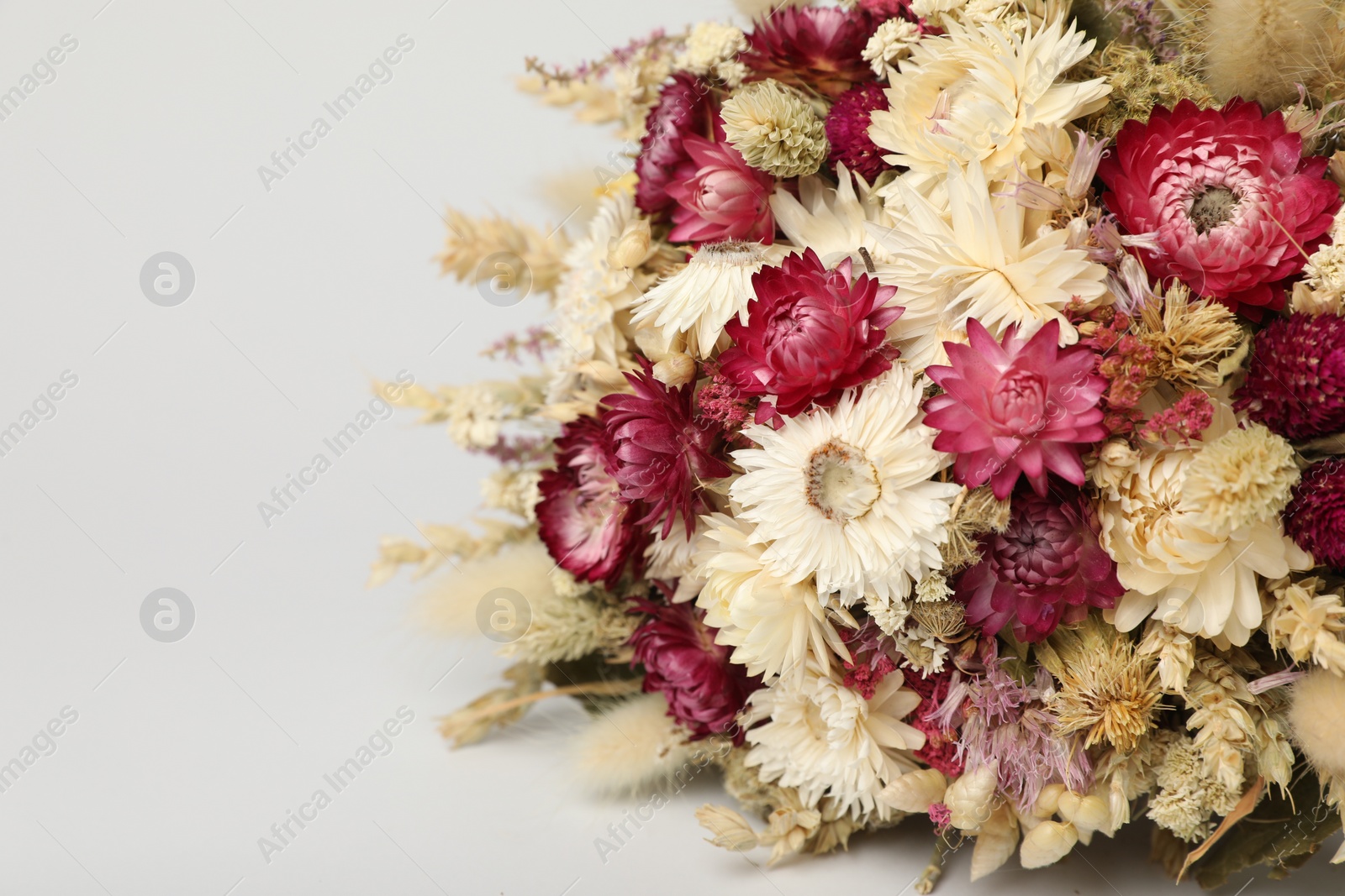 Photo of Beautiful bouquet of dry flowers on white background, closeup. Space for text