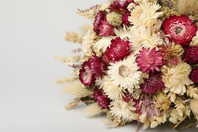 Beautiful bouquet of dry flowers on white background, closeup. Space for text