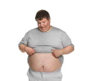 Photo of Emotional overweight man posing on white background