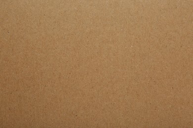 Kraft paper notebook sheet as background, top view