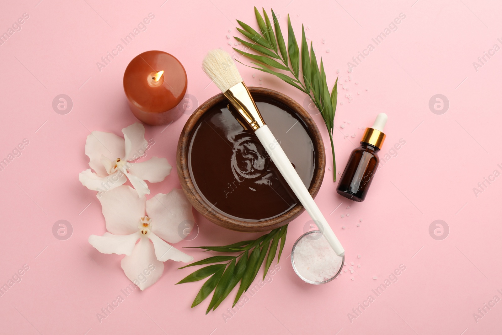 Photo of Flat lay composition with cosmetic product for spa body wraps on light pink background