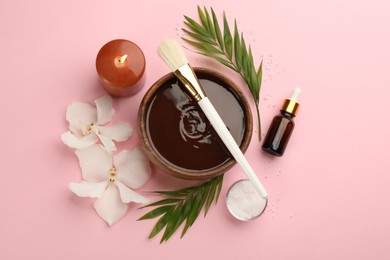 Photo of Flat lay composition with cosmetic product for spa body wraps on light pink background