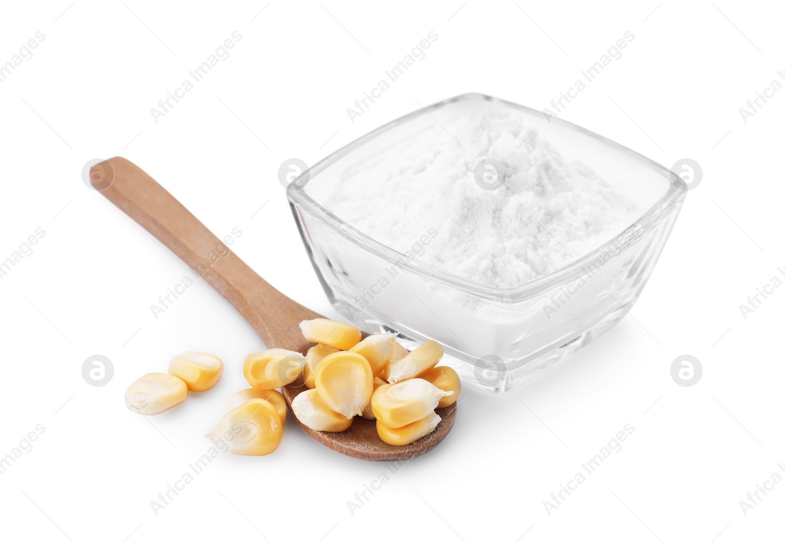 Photo of Bowl of corn starch and wooden spoon with kernels isolated on white