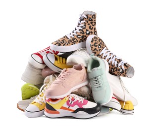 Pile of different female sneakers isolated on white