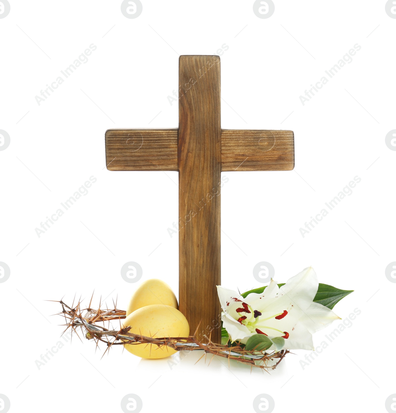 Photo of Wooden cross, blossom lily, Easter eggs and crown of thorns on white background