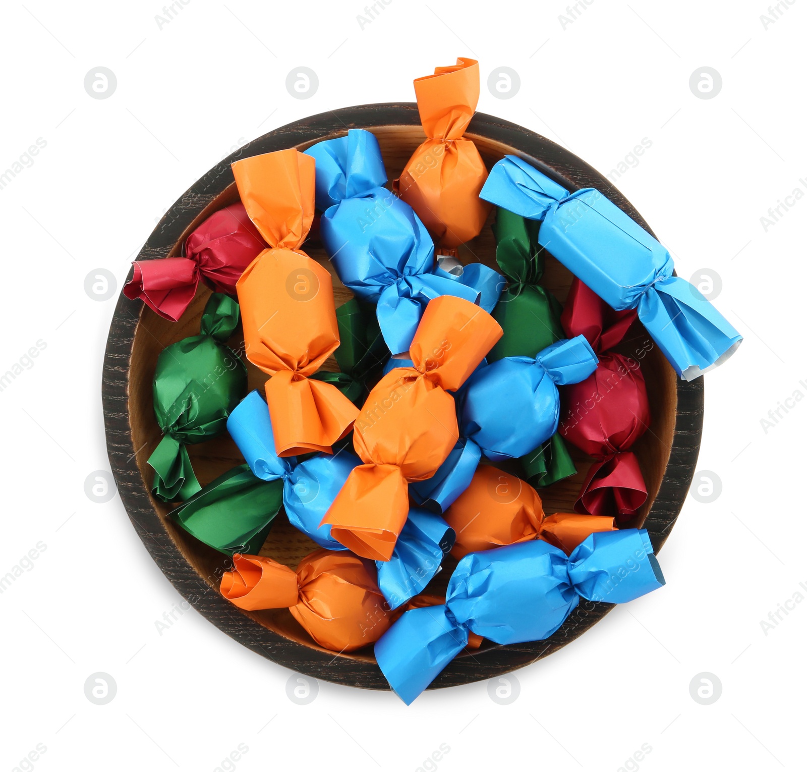 Photo of Bowl with candies in colorful wrappers isolated on white, top view