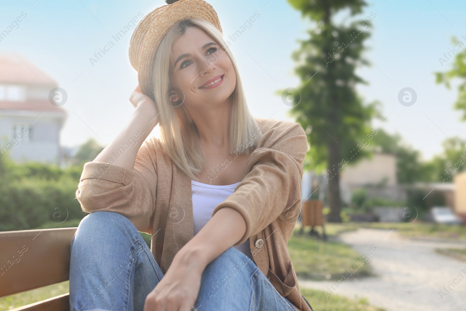 Photo of Portrait of beautiful woman in straw hat outdoors on sunny day