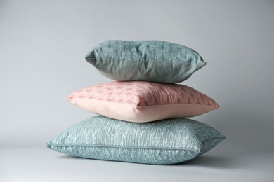 Soft decorative pillows on light background