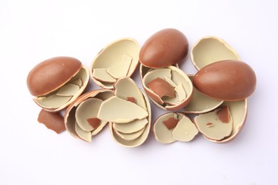 Photo of Sveti Vlas, Bulgaria - July 3, 2023: Broken halves of Kinder Surprise Eggs isolated on white, top view
