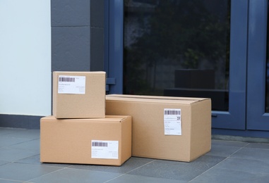 Parcel boxes on floor near office entrance