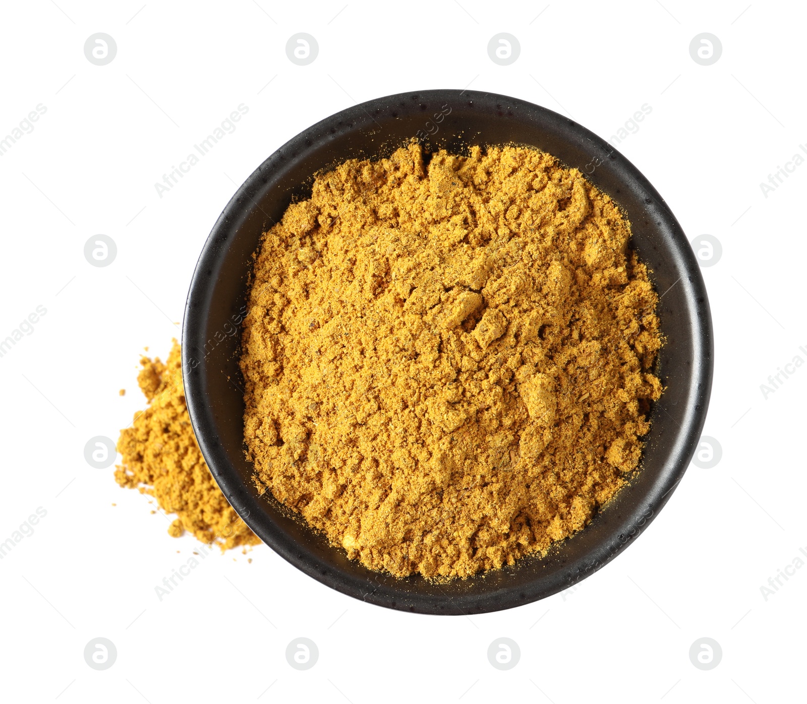 Photo of Dry curry powder in bowl isolated on white, top view