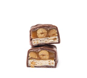 Photo of Cut chocolate bar with caramel, nuts and nougat isolated on white