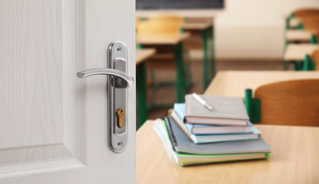 Wooden door open into modern empty classroom, banner design