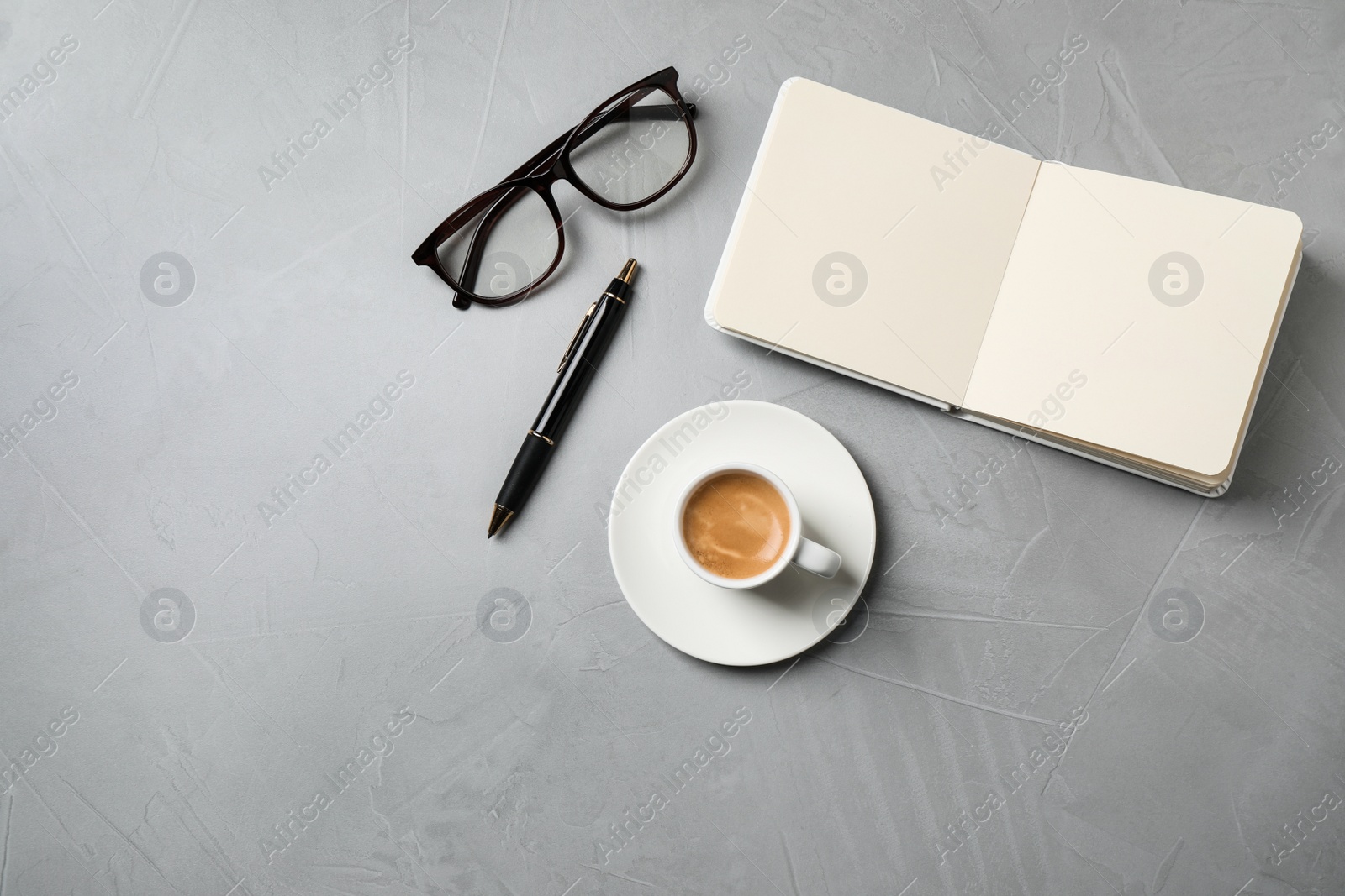 Photo of Flat lay composition with coffee on grey table. Tasty breakfast