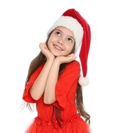 Photo of Cute little child in Santa hat posing on white background. Christmas celebration