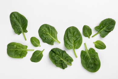 Fresh leaves of spinach isolated on white, top view