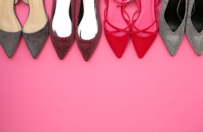 Photo of Different female shoes on color background