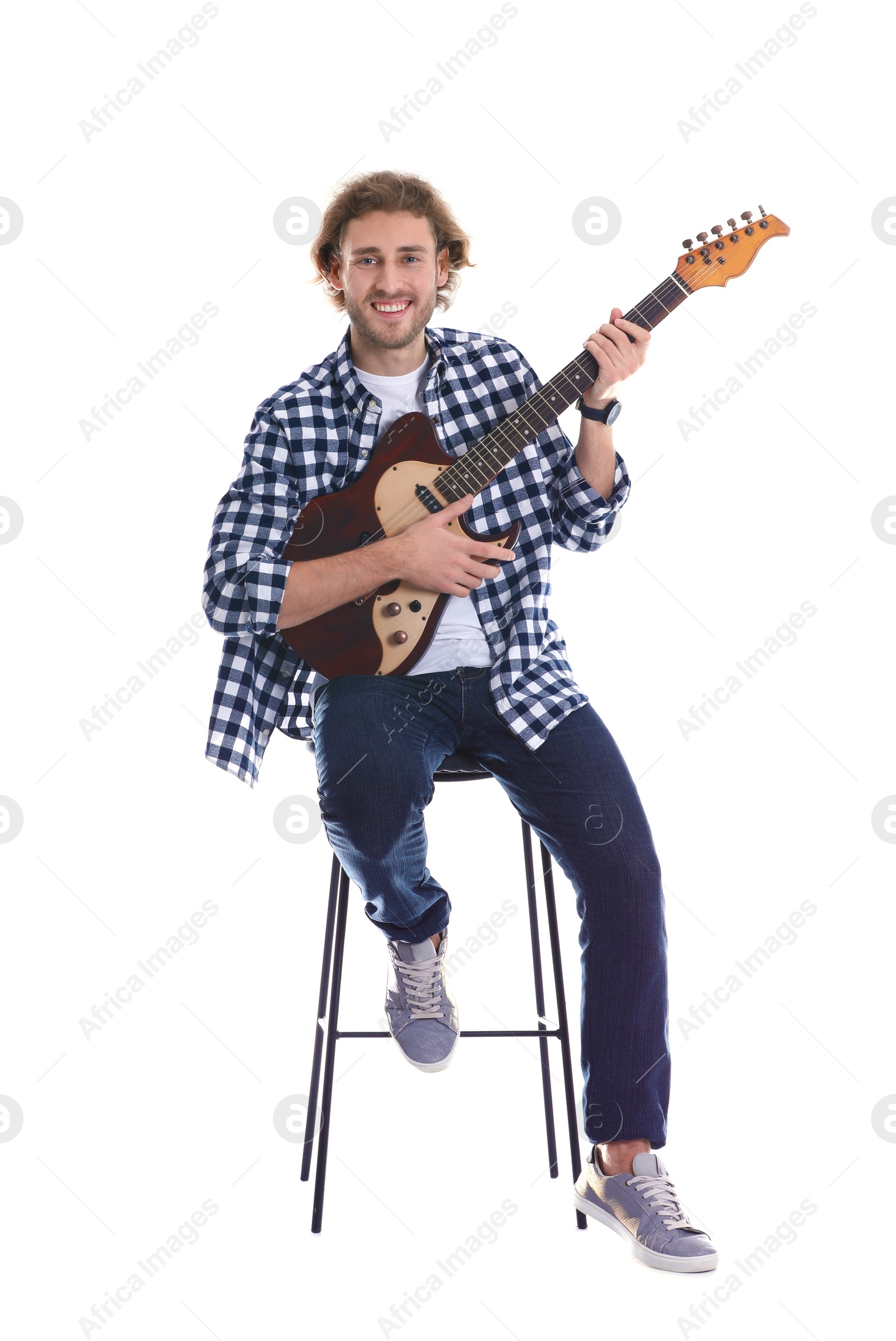 Photo of Young man playing electric guitar on white background