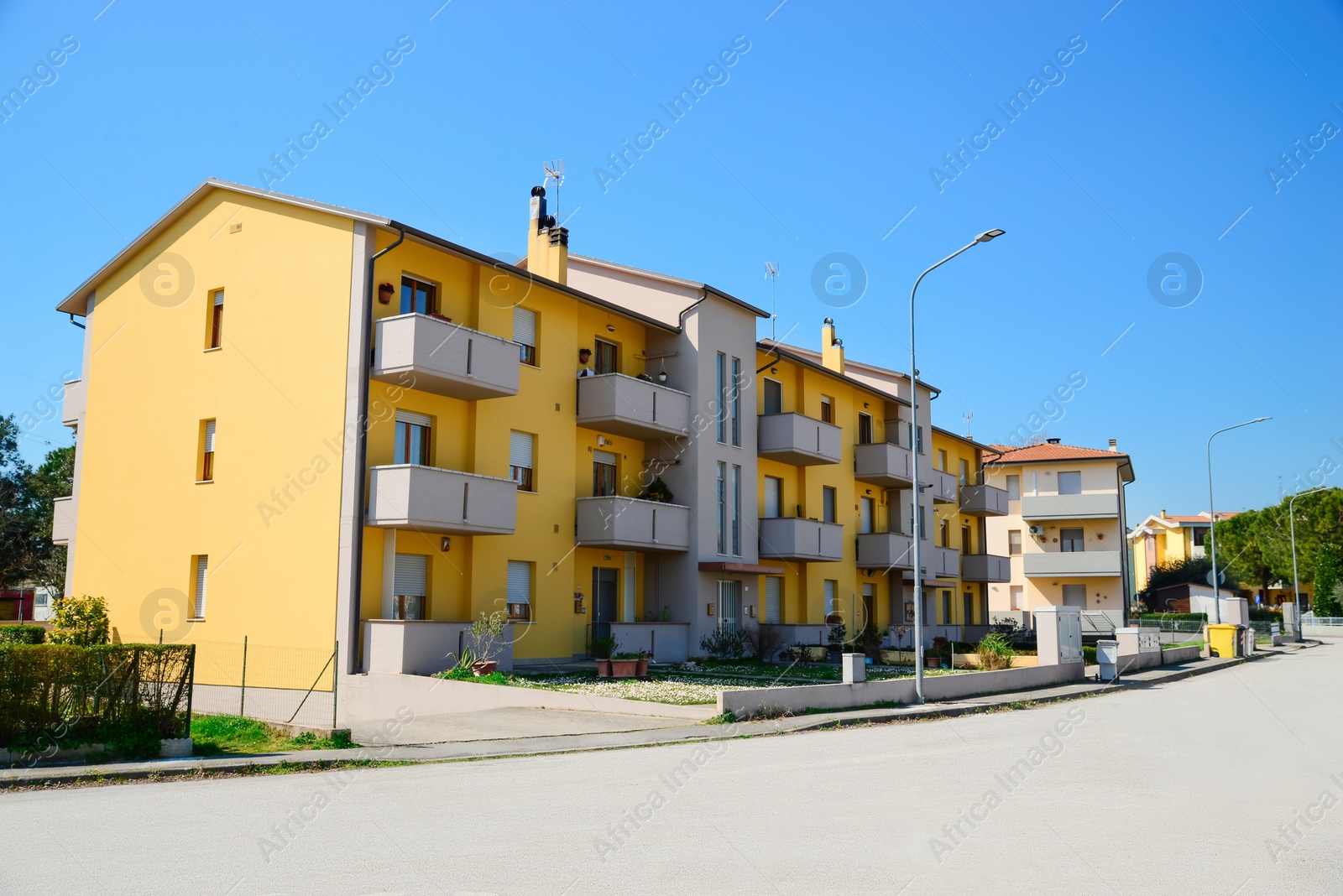 Photo of Picturesque view of city street with beautiful buildings on sunny day