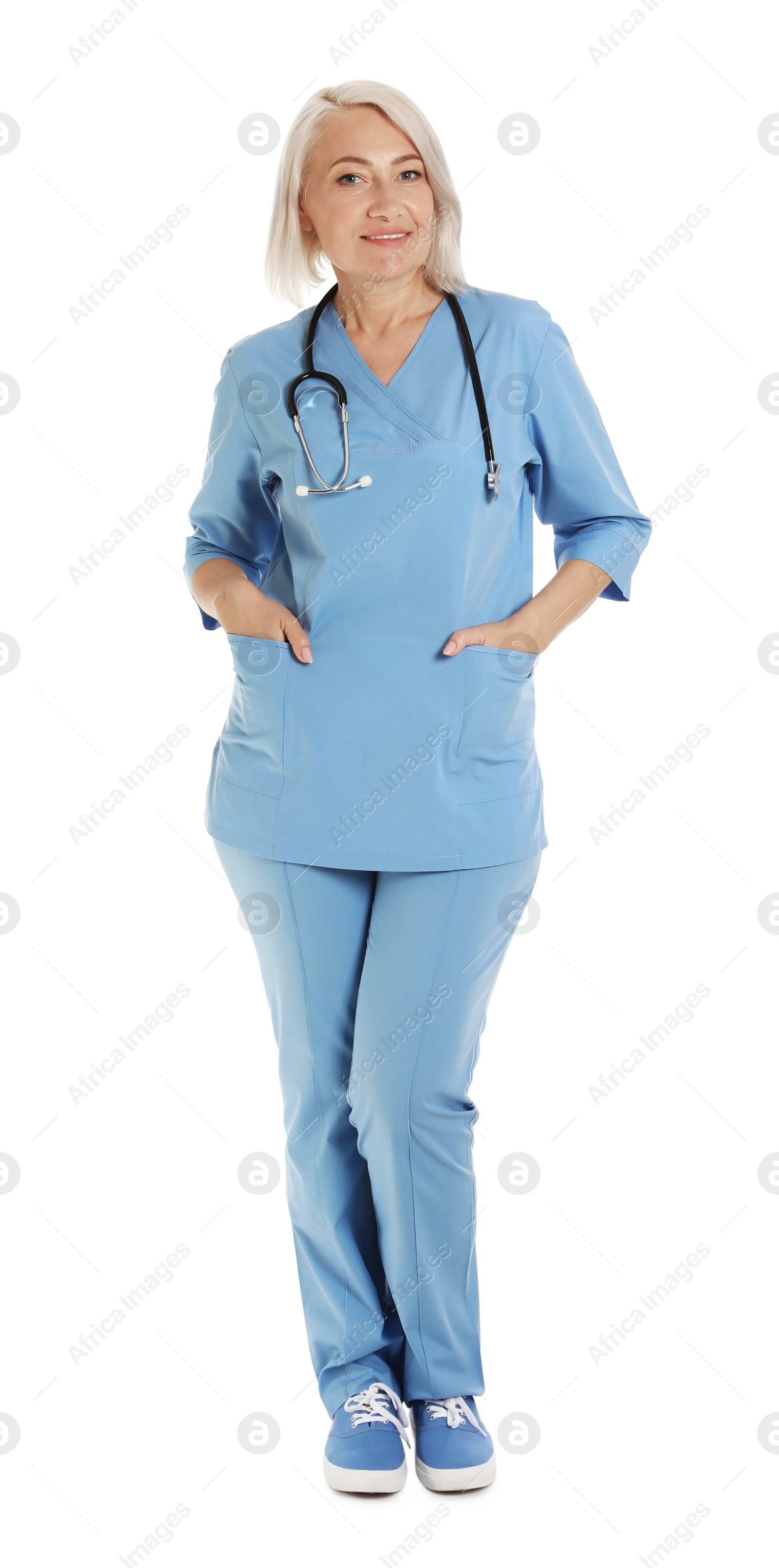 Photo of Full length portrait of female doctor in scrubs isolated on white. Medical staff