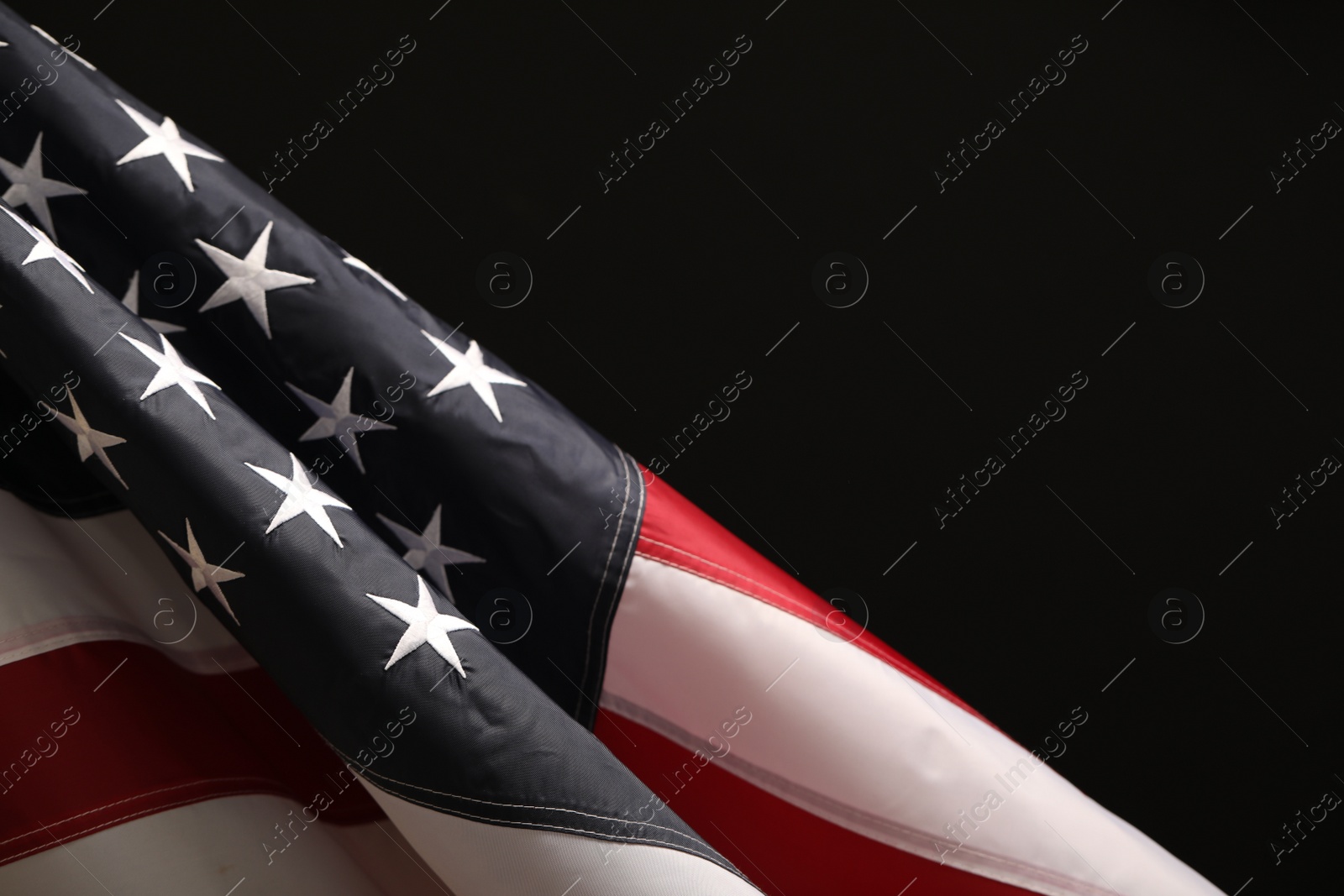 Photo of National flag of America on black background, space for text. Memorial day celebration