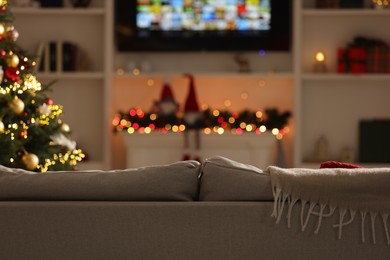 Photo of Living room interior with sofa and festive decor. Christmas celebration