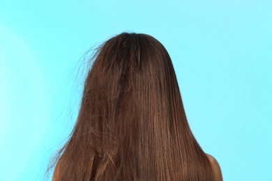 Woman before and after hair treatment on color background