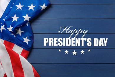 Image of Happy President's Day - federal holiday. American flag and text on blue wooden background, top view