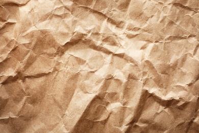 Brown paper bag texture as background, top view