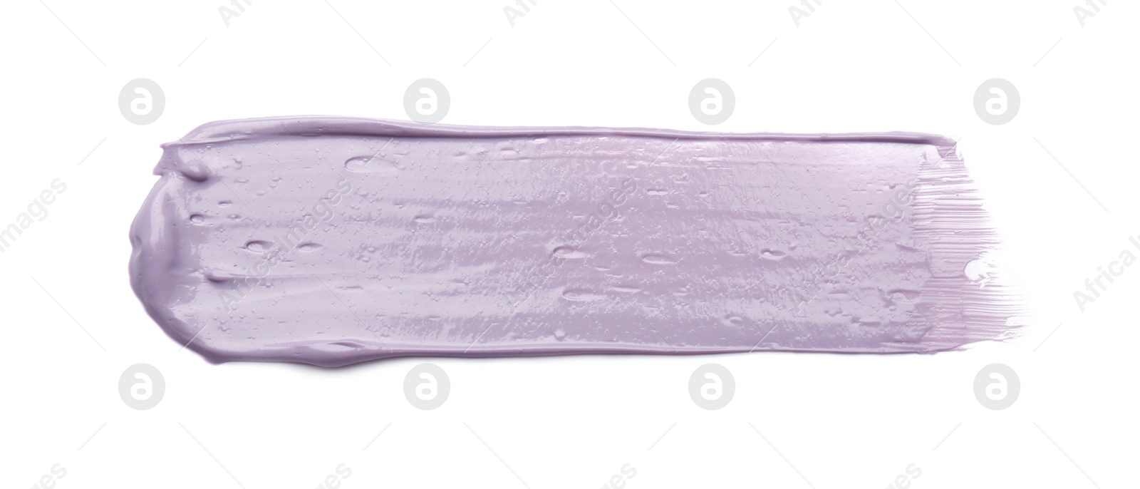 Photo of Stroke of purple correcting concealer isolated on white, top view