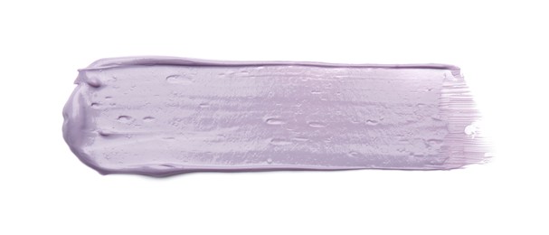 Photo of Stroke of purple correcting concealer isolated on white, top view