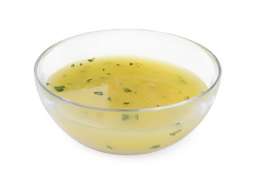 Bowl with lemon sauce on white background. Delicious salad dressing