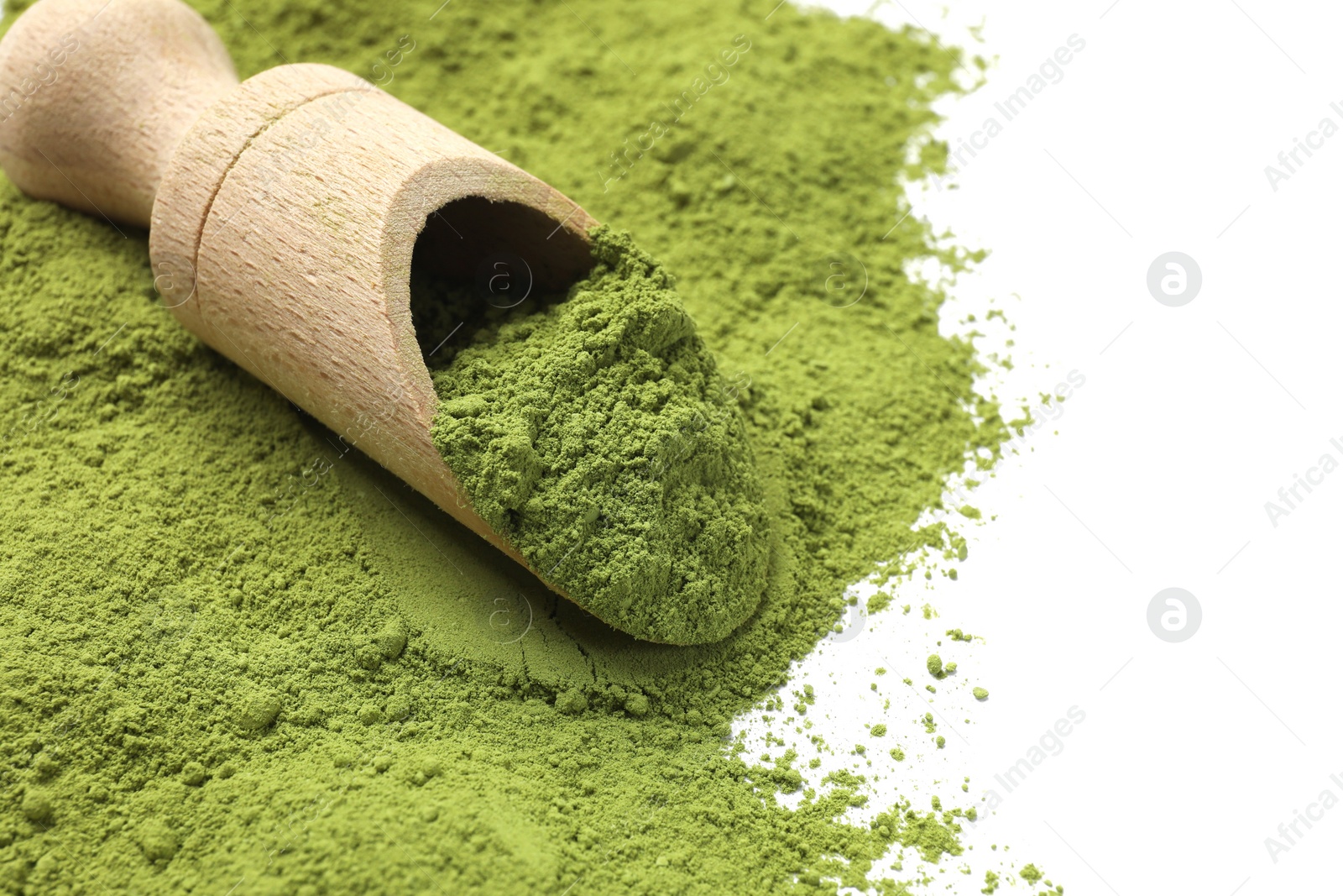 Photo of Green matcha powder and wooden scoop isolated on white