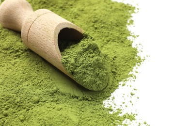 Photo of Green matcha powder and wooden scoop isolated on white