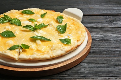 Photo of Fresh tasty homemade pizza on table, closeup