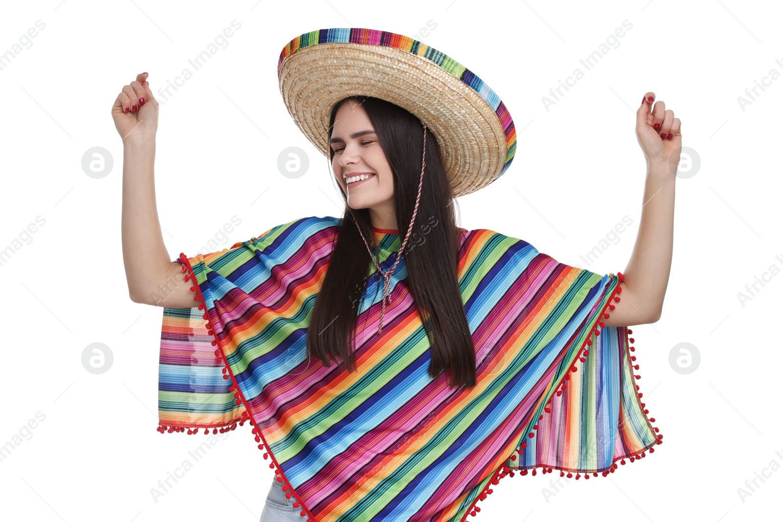 Photo of Young woman in Mexican sombrero hat and poncho dancing on white background