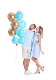 Photo of Young couple with air balloons on white background