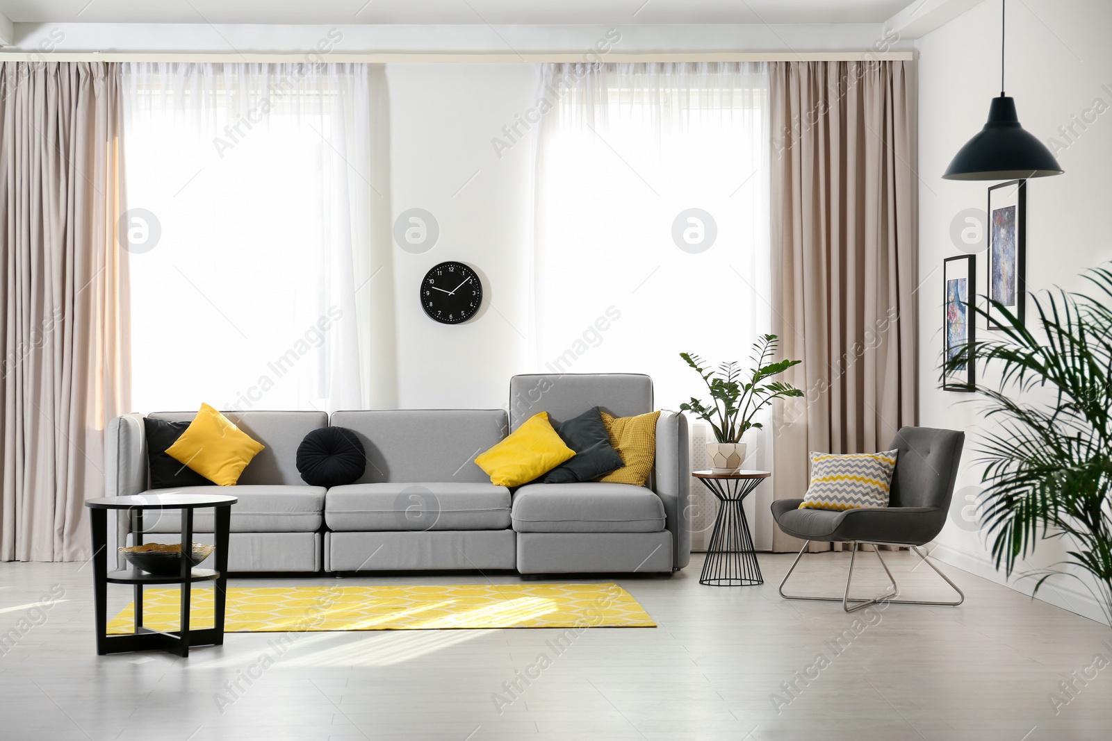 Photo of Stylish living room interior with comfortable sofa. Space for text