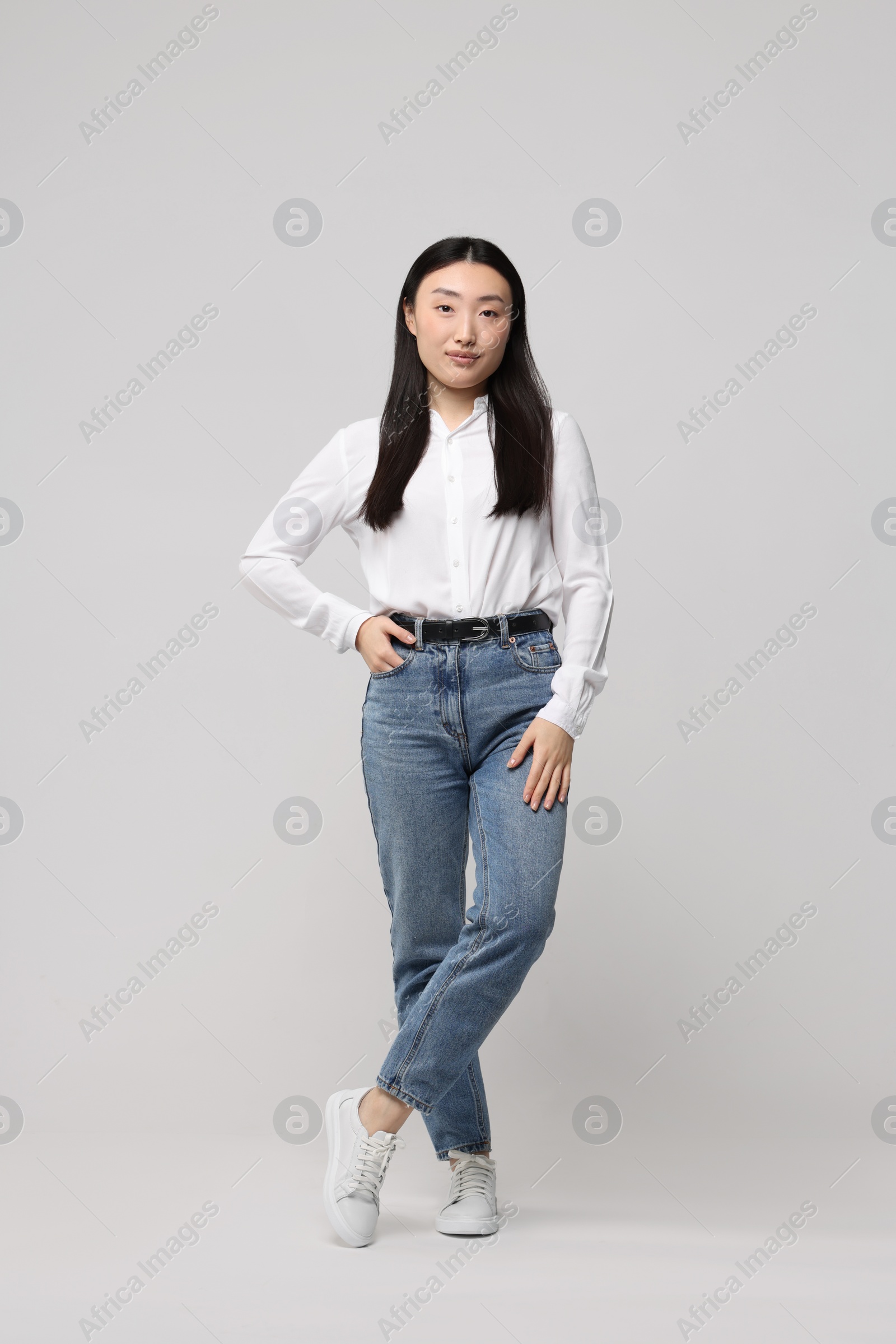 Photo of Full length portrait of beautiful woman on light background