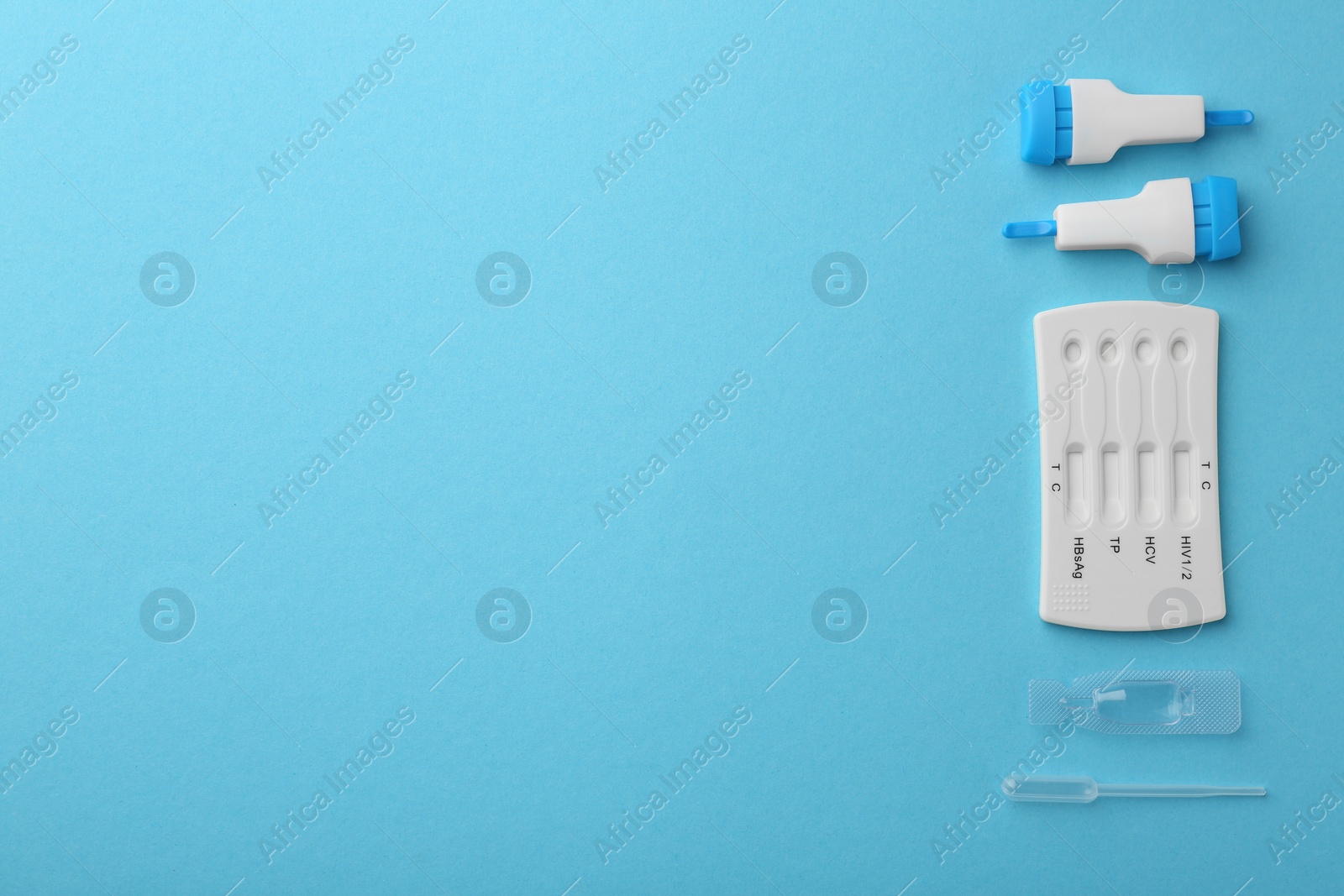 Photo of Disposable multi-infection express test kit on light blue background, flat lay. Space for text