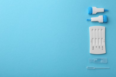 Photo of Disposable multi-infection express test kit on light blue background, flat lay. Space for text