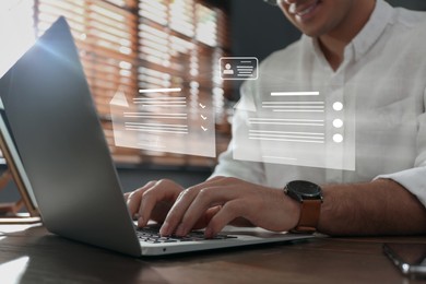 Concept of electronic signature. Man working on laptop at wooden table indoors, closeup