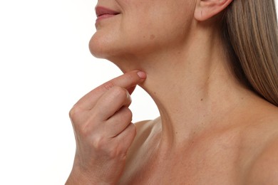 Mature woman touching her neck on white background, closeup