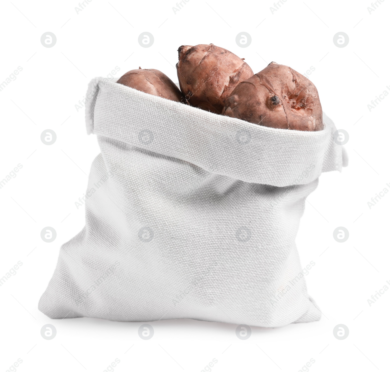 Photo of Bag with many Jerusalem artichokes isolated on white