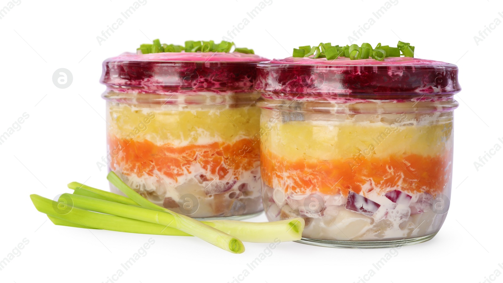 Photo of Jars with herring under fur coat isolated on white. Traditional Russian salad